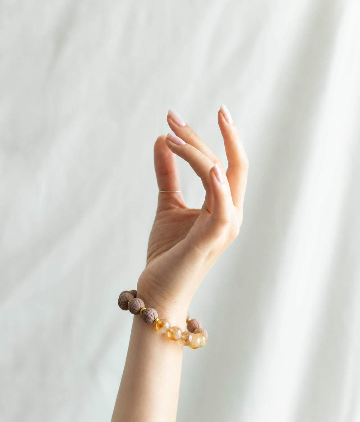 FU YUI bracelet worn in soft natural light
